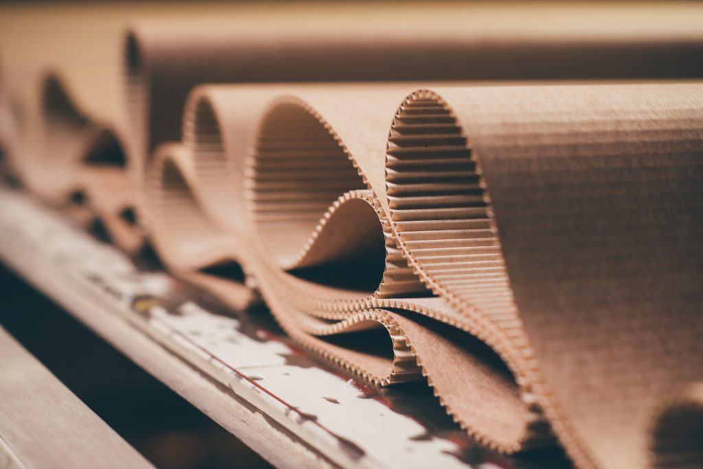 Corrugated flutes on a conveyor