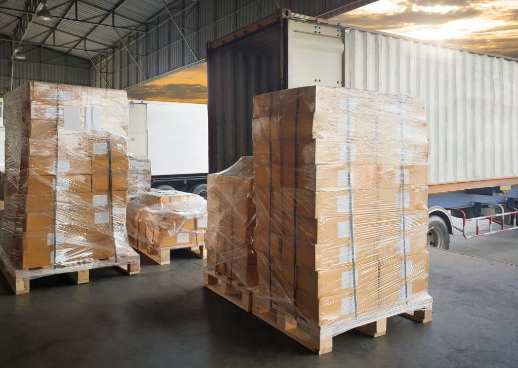 Wrapped pallets of boxes at a loading dock